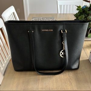 Black MK tote bag with gold accents